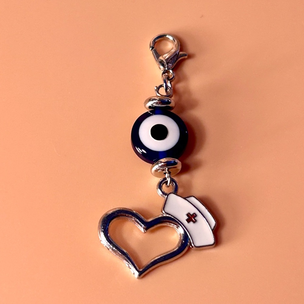 🧿🩵 Evil Eye Badge Reel Charm